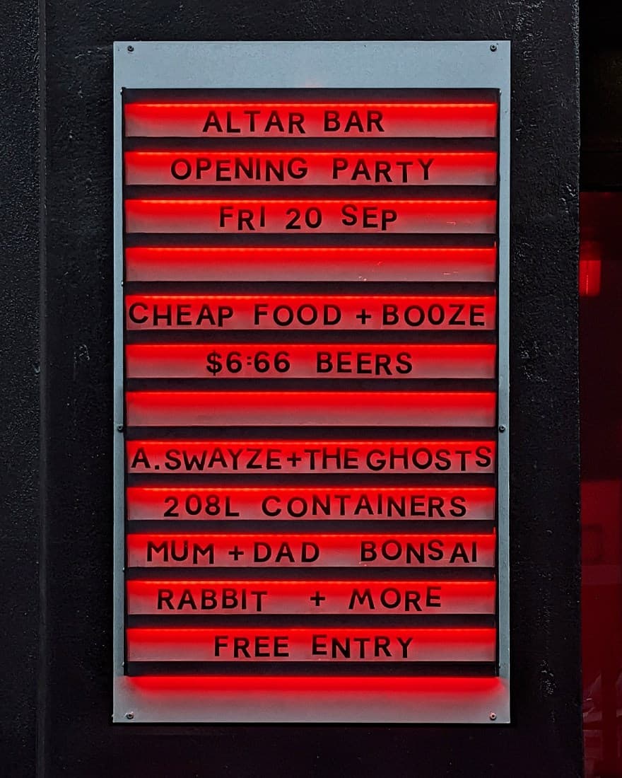 Letter board sign reading 'Altar Bar Opening Party'